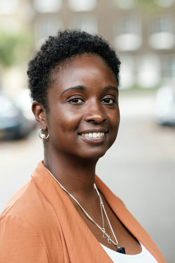 Head-shot of curly black woman.