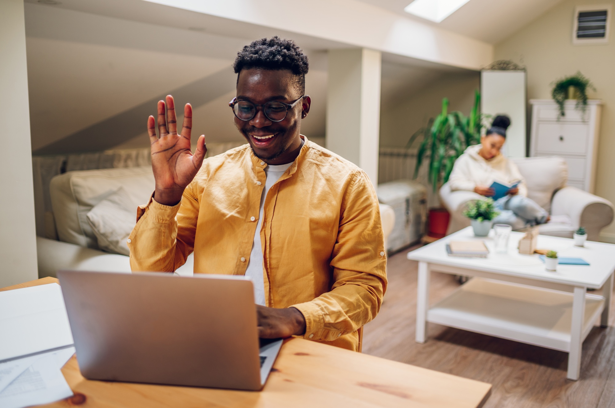 African american man using laptop for a video call at home