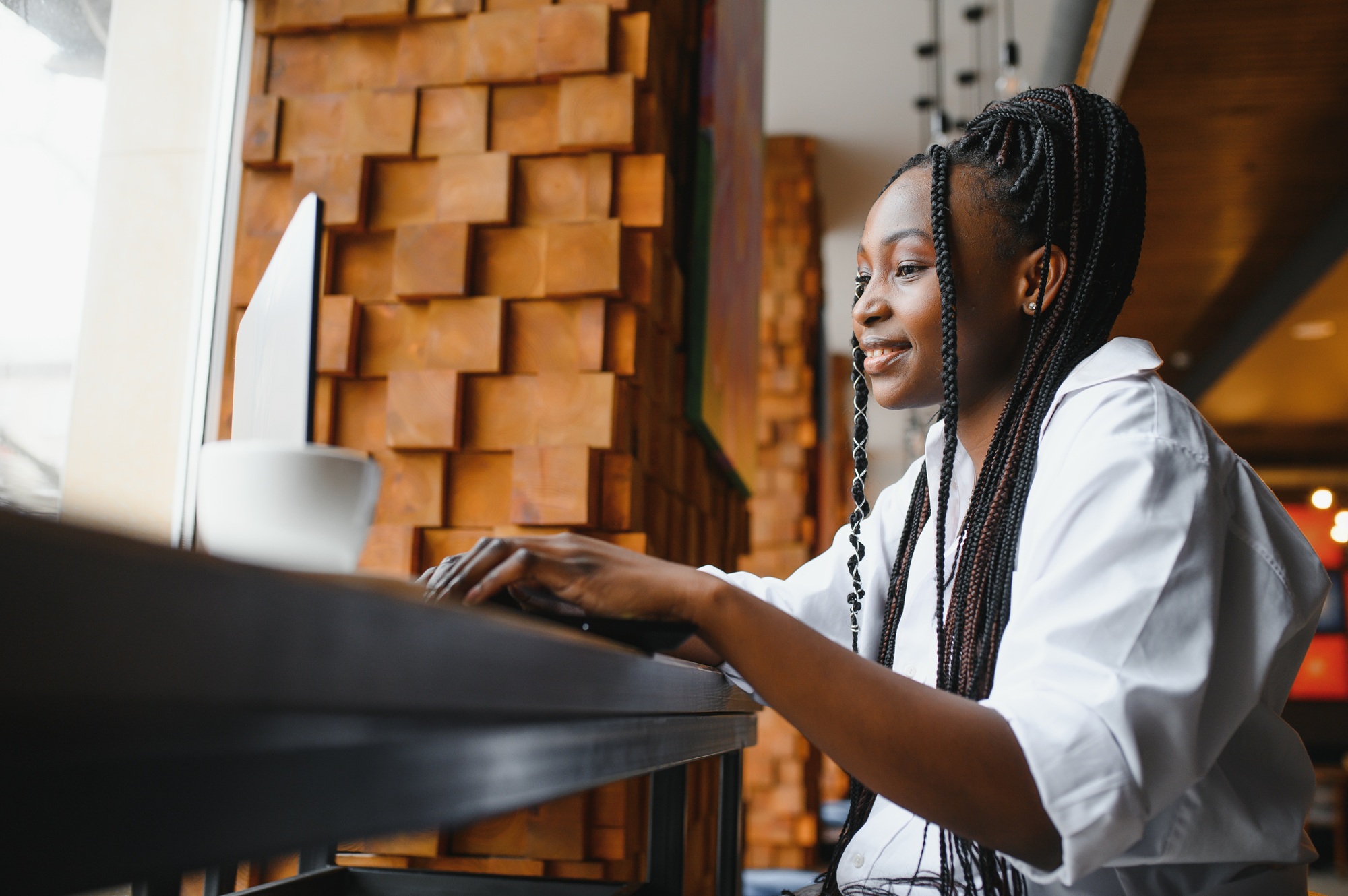 Beautiful african business woman waiting for the meeting in a co-working space